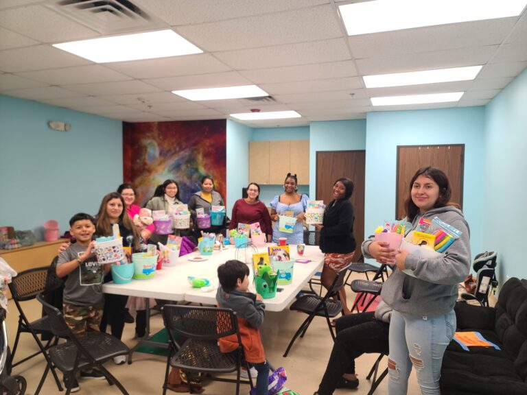 young people gathered around at a table